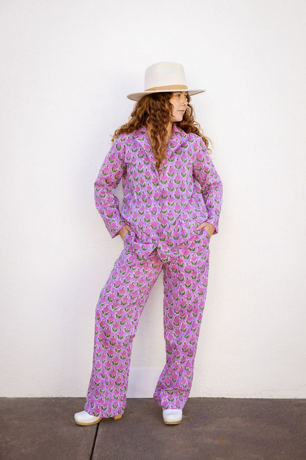 Four piece patterned cotton pjs featuring button down top, shorts, pants and matching tote. Pants with pockets. Pink floral design.