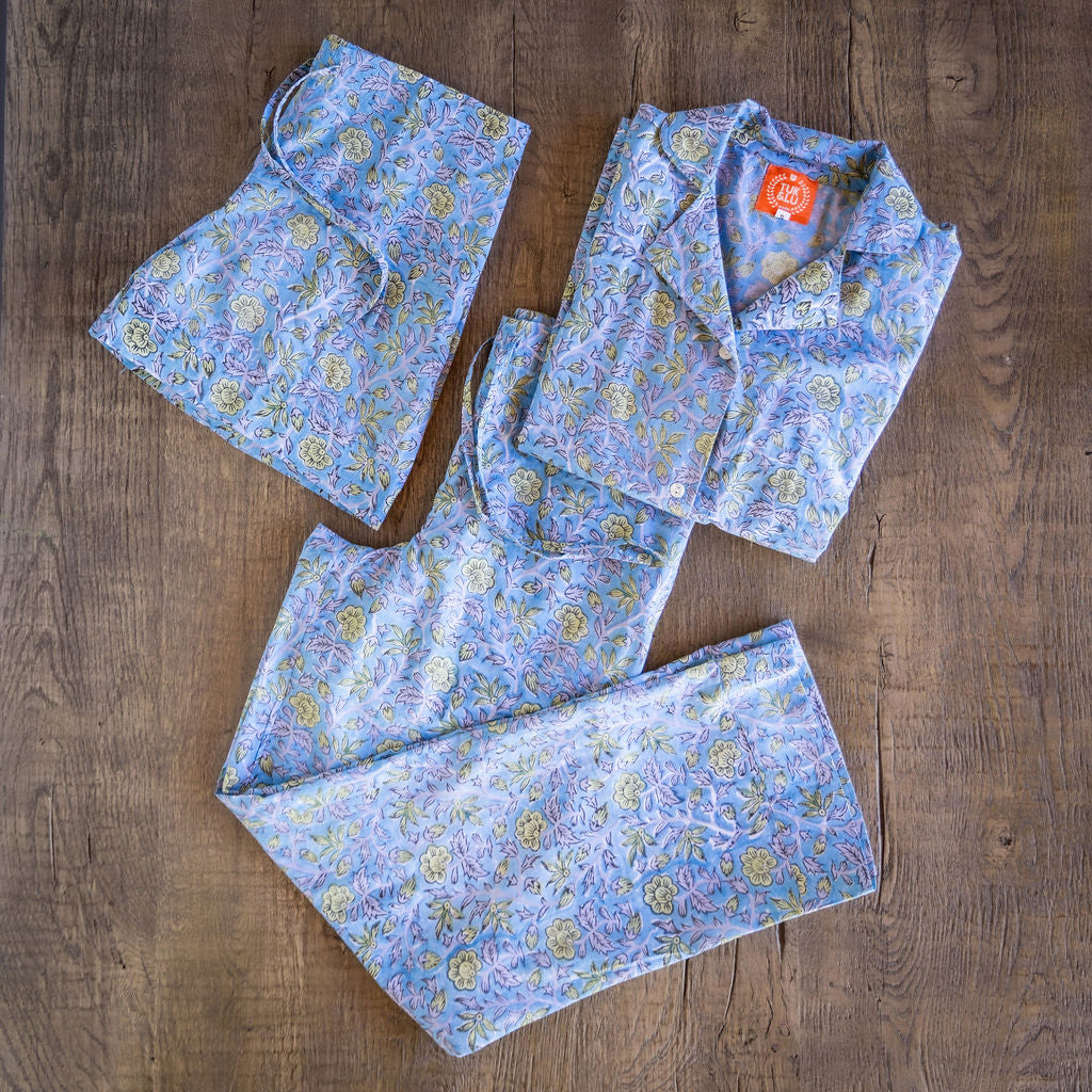 Four piece patterned cotton pjs featuring button down top, shorts, pants and matching tote.