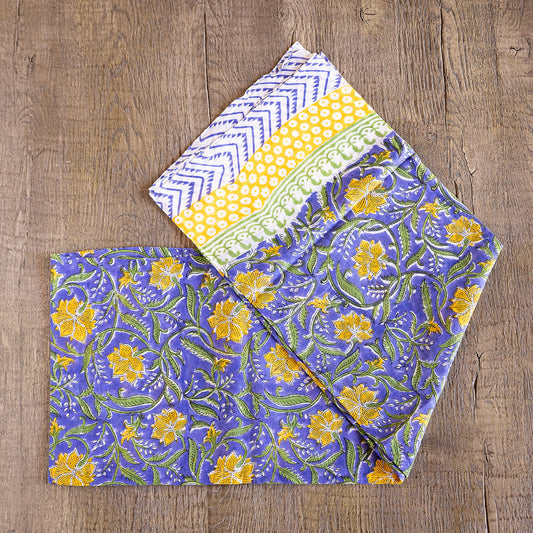 Unique hand-blocked printed, 100% cotton sarongs. Yellow floral on periwinkle.
