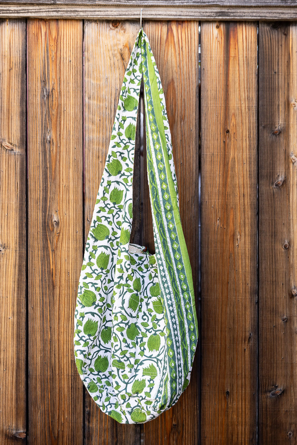 Unique slouch bag collection. Available in different patterns and colors. Green floral pattern.