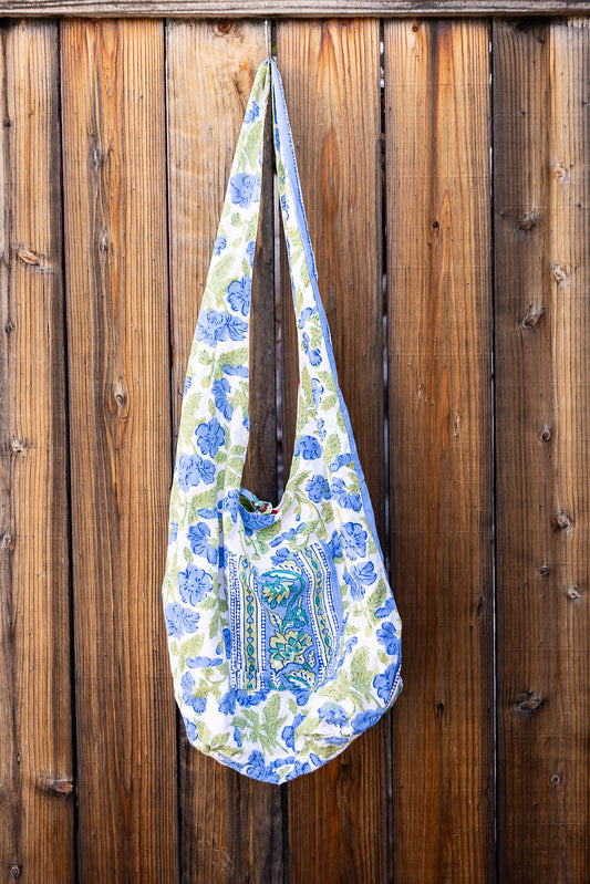 Unique, reversible slouch bag collection. Available in different patterns and colors. Lavender and green design.