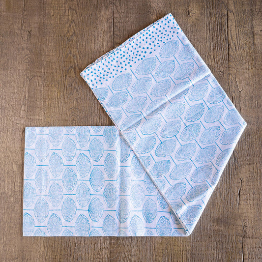 Image of Tuk and Lu's Sarong. Can be use as a shawl or cover up. Blue pattern on white.