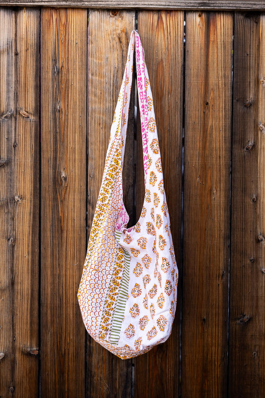 Unique, reversible slouch bag collection. Available in different patterns and colors. Pink and yellow patterns.