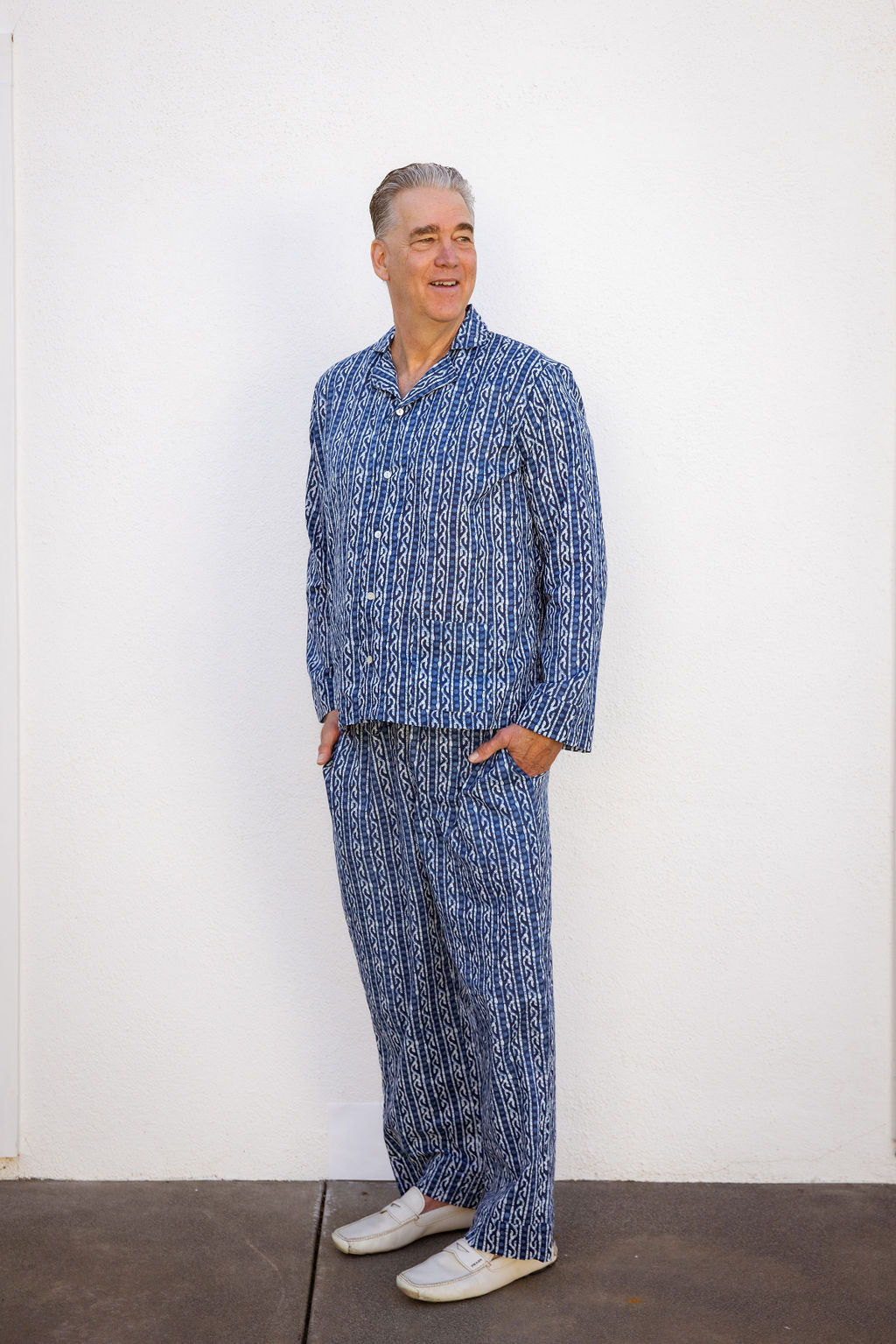 Men's Four piece patterned cotton pjs featuring button down top, shorts, pants and matching tote. Pant. Blue pattern.