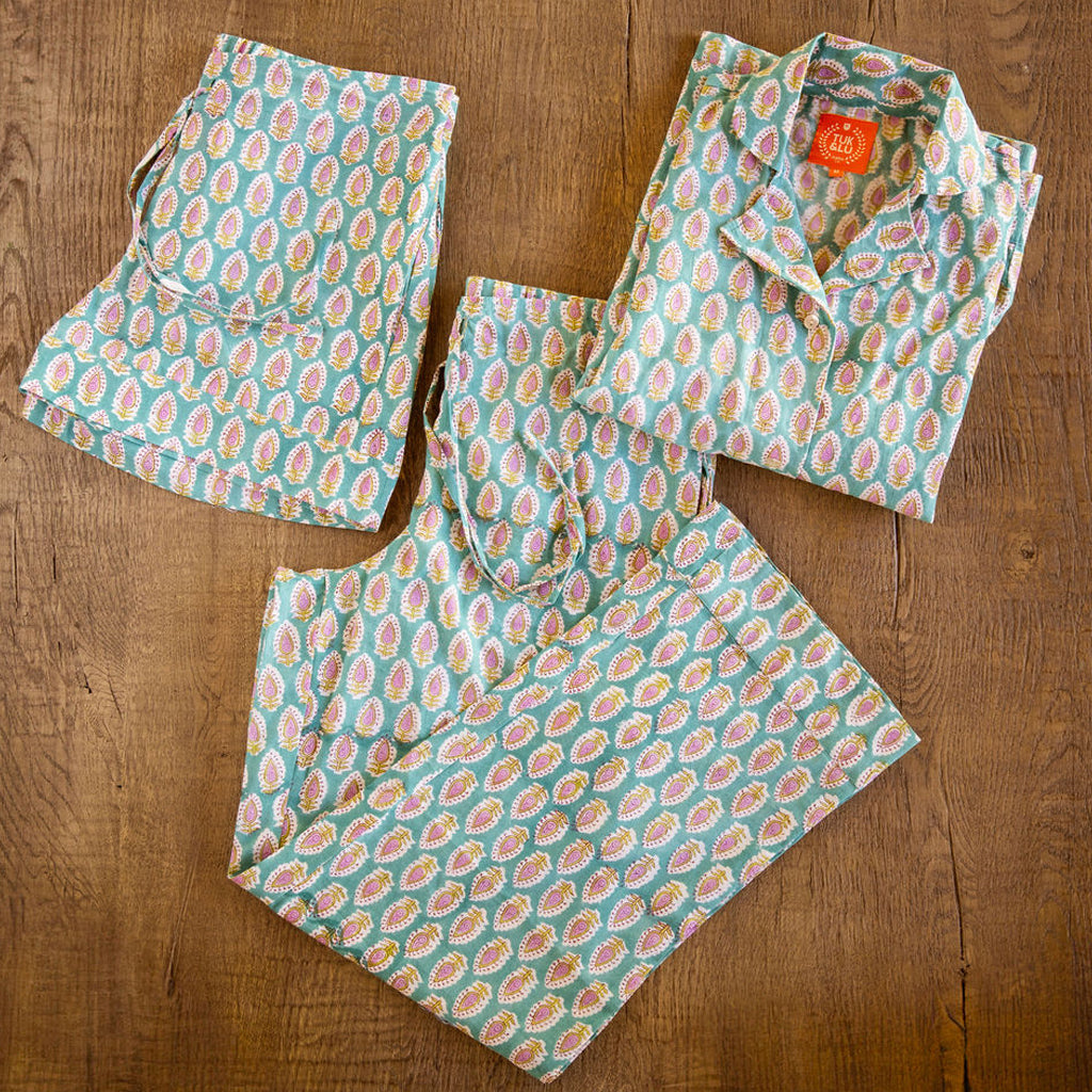 Four piece patterned cotton pjs featuring button down top, shorts, pants and matching tote. Paisley design. 