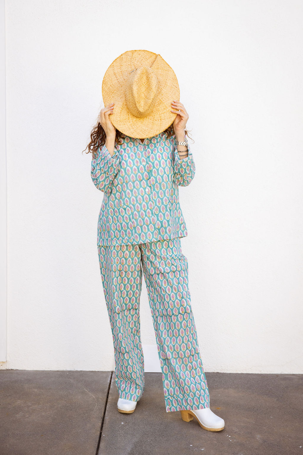 Four piece patterned cotton pjs featuring button down top, shorts, pants and matching tote. Pants with pockets. Paisley design. 