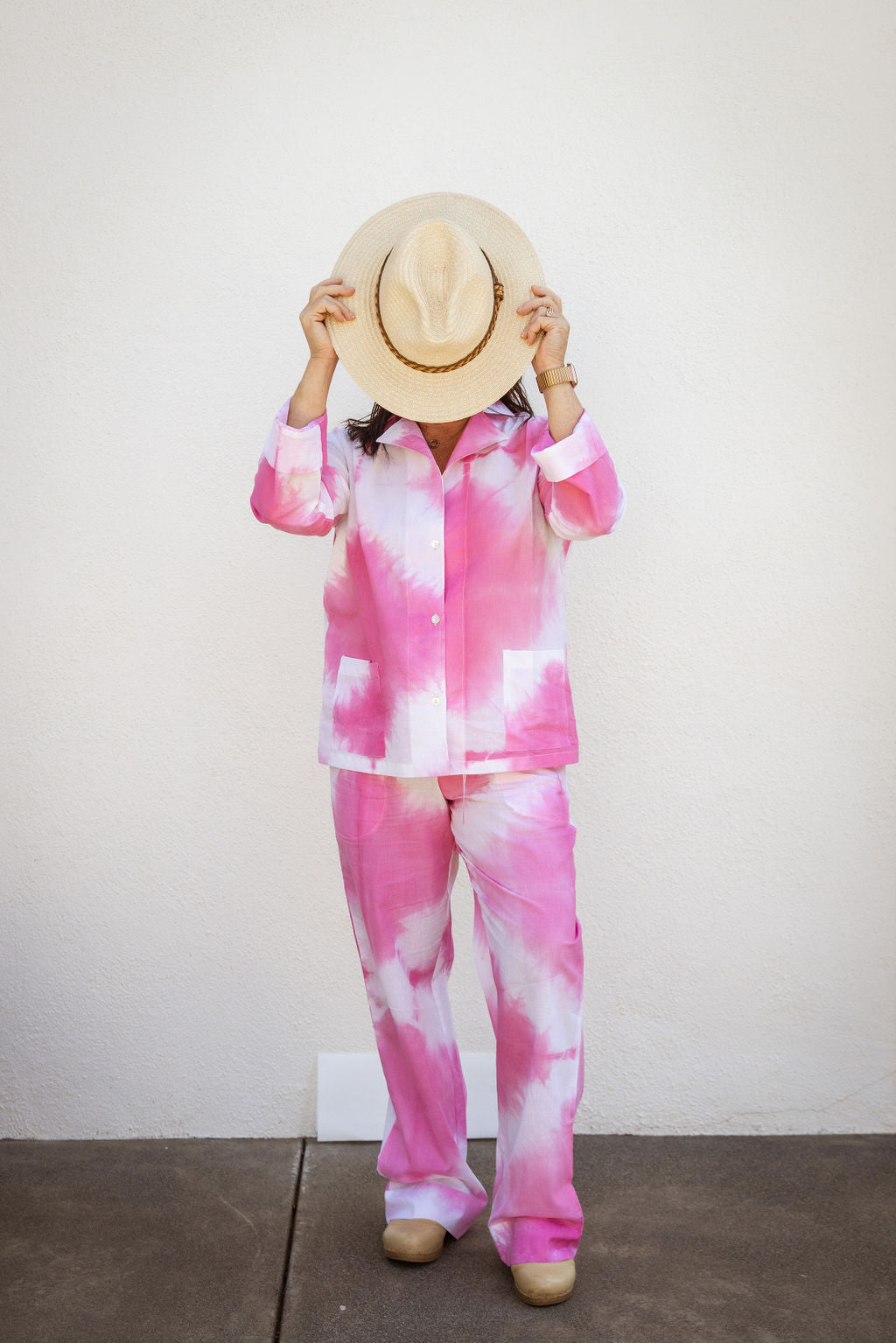 Model wearing Tuk and Lu's pink tie-dyed cotton PJ set with the pant. Also comes with shorts and tote.