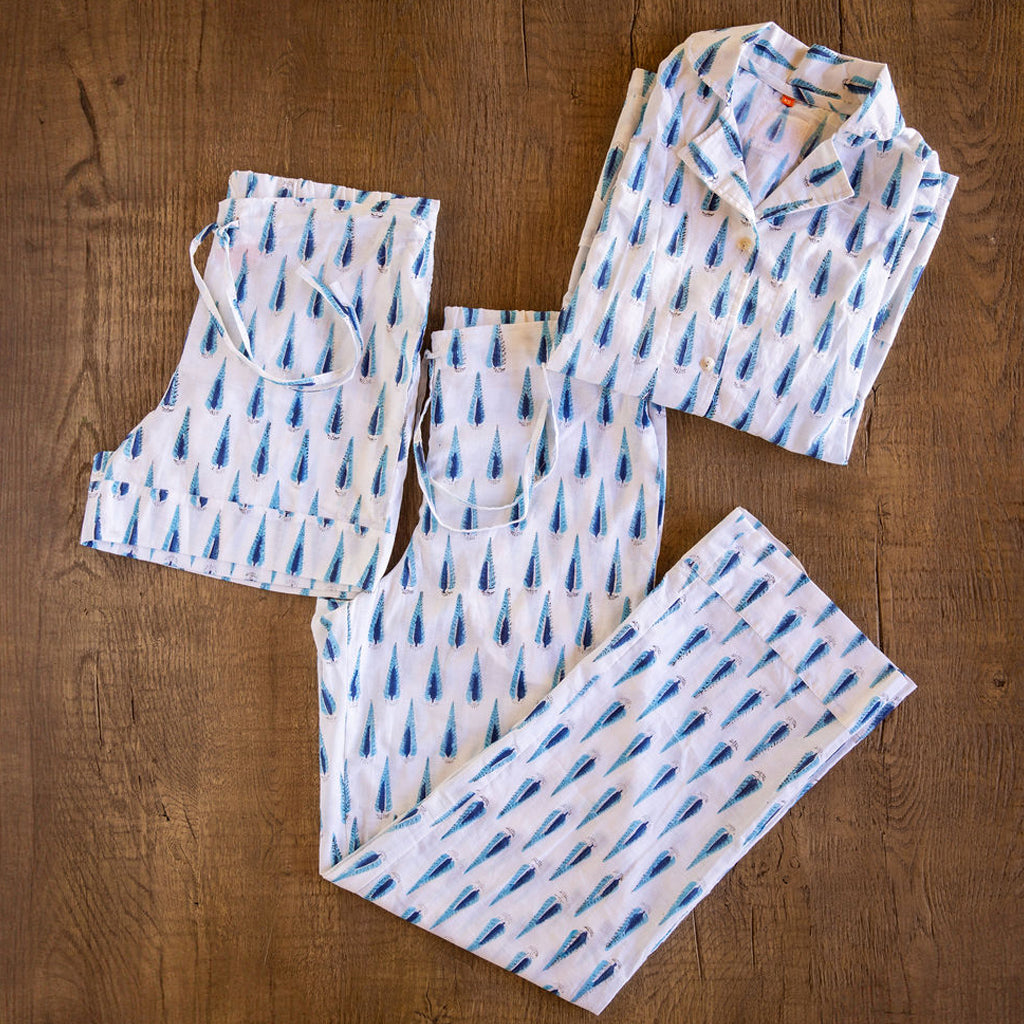 Four piece patterned cotton pjs featuring button down top, shorts, pants and matching tote.