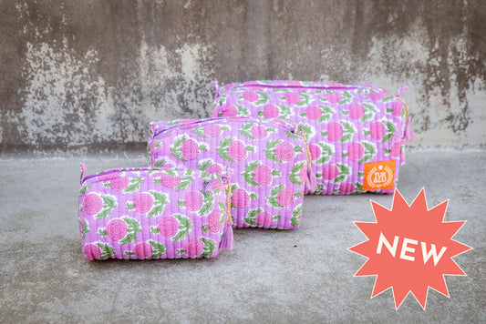 Set of three blue patterned cotton cosmetic bags. Smaller bags fit into the largest for easy storage.