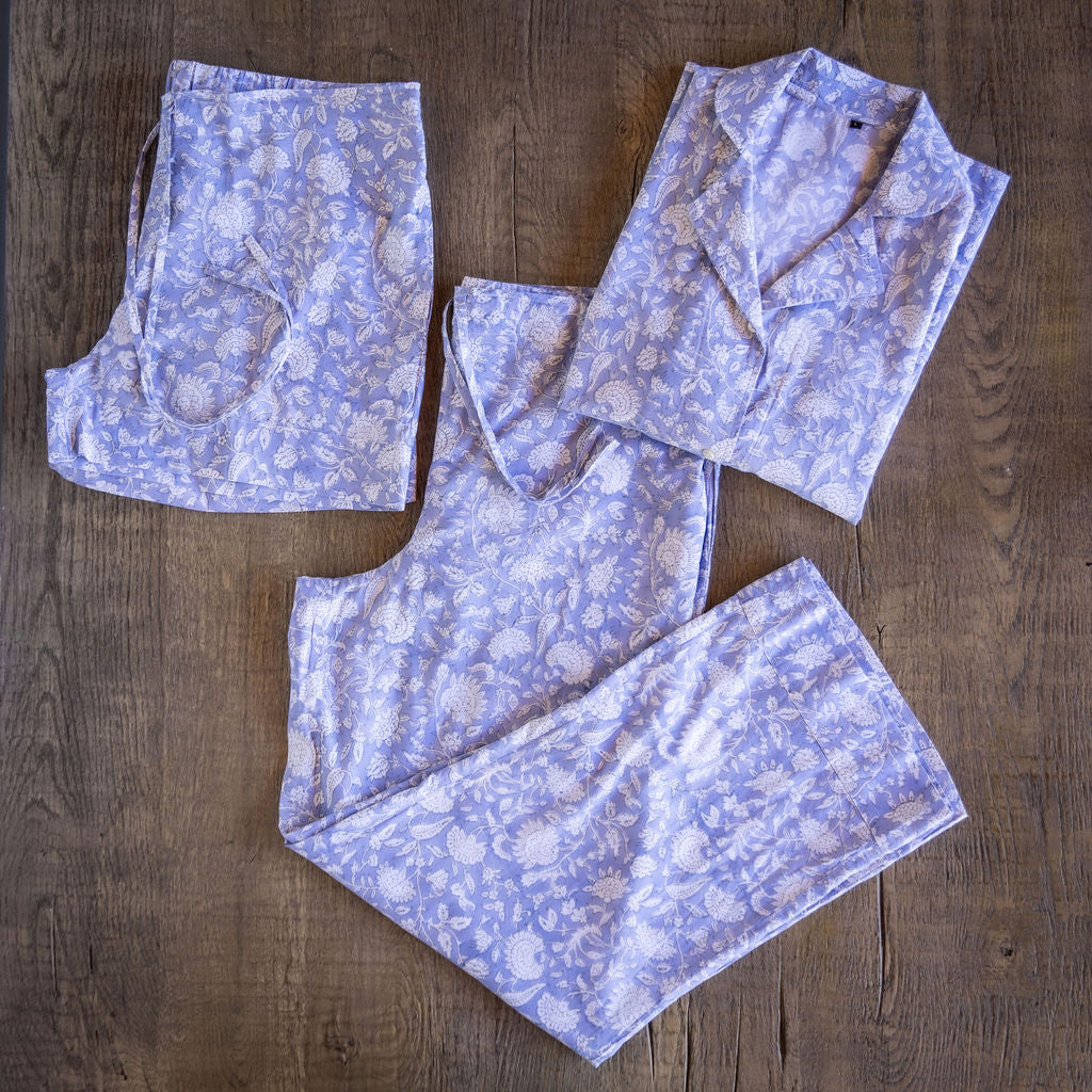 Four piece patterned cotton pjs featuring button down top, shorts, pants and matching tote.