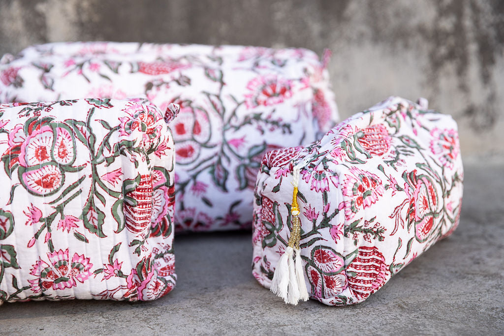 Set of three multi-colored patterned cotton cosmetic bags. Red and Grey. Detail.