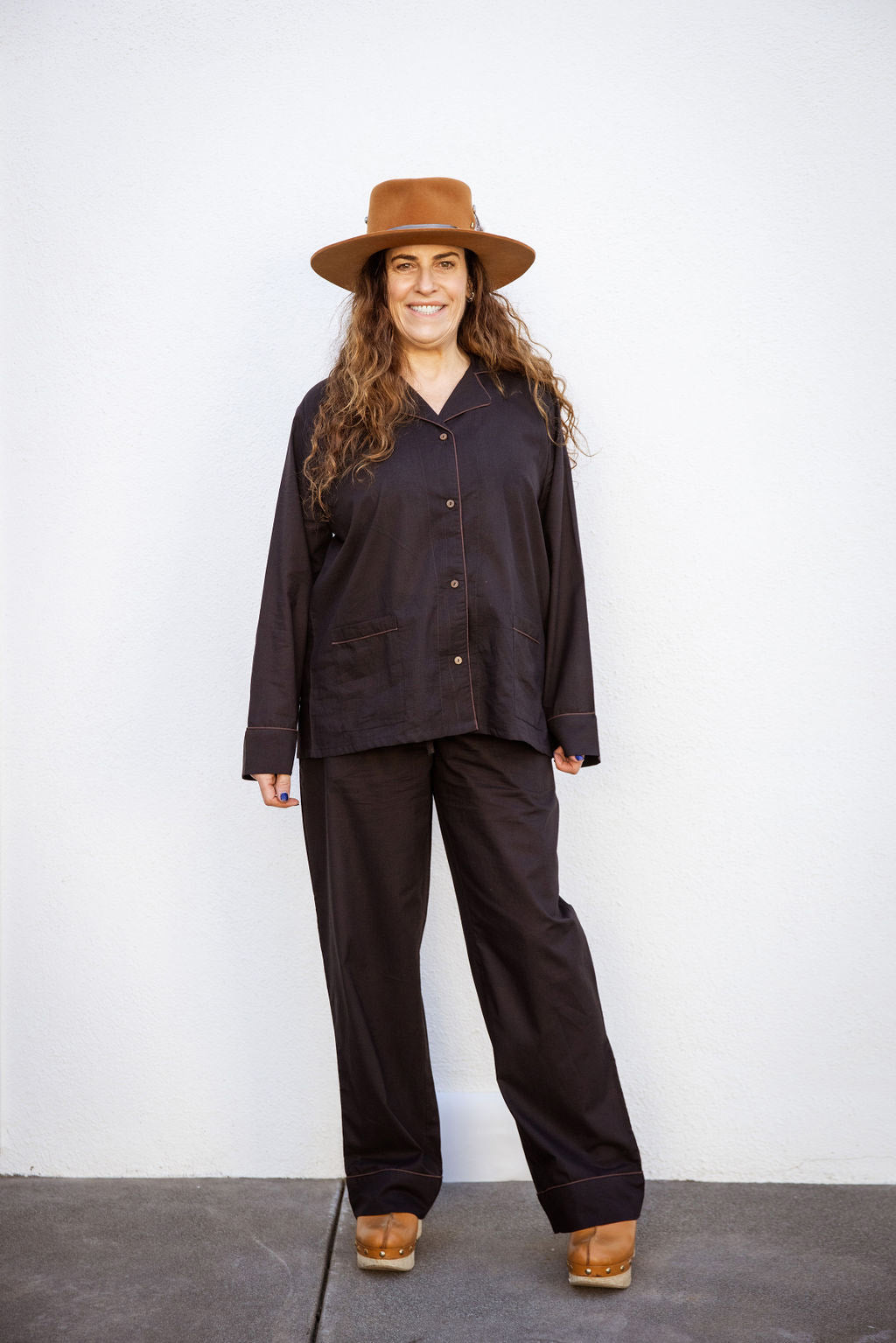 Model wearing Tuk and Lu's black cotton PJ set with the pant. Also comes with shorts and tote.