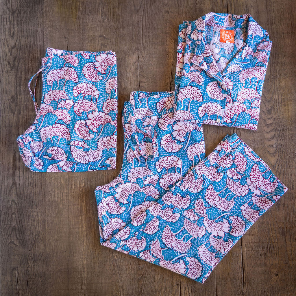 Four piece patterned cotton pjs featuring button down top, shorts, pants and matching tote.