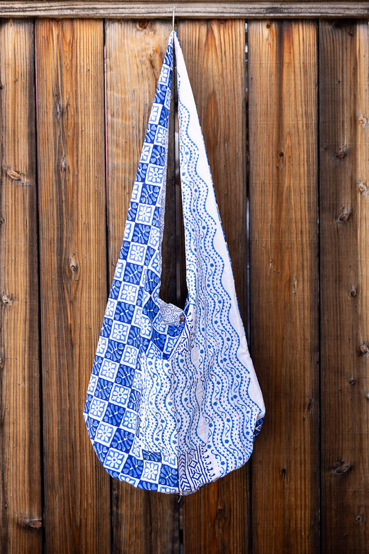 Unique slouch bag collection. Available in different patterns and colors. Two blue pattens on white design.